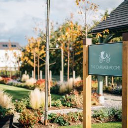 Grenadier wooden entrance welcome sign