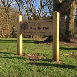 Woodsman badging park sign