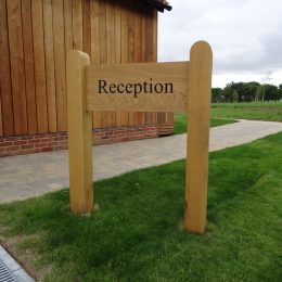 Woodsman badging sign wood