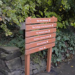 Wood effect plastic directional ladder sign