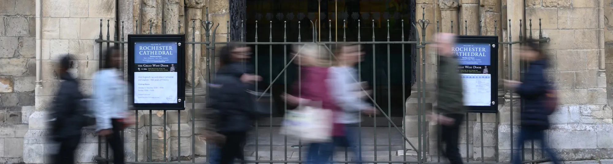 rochester noticeboards with passing people header